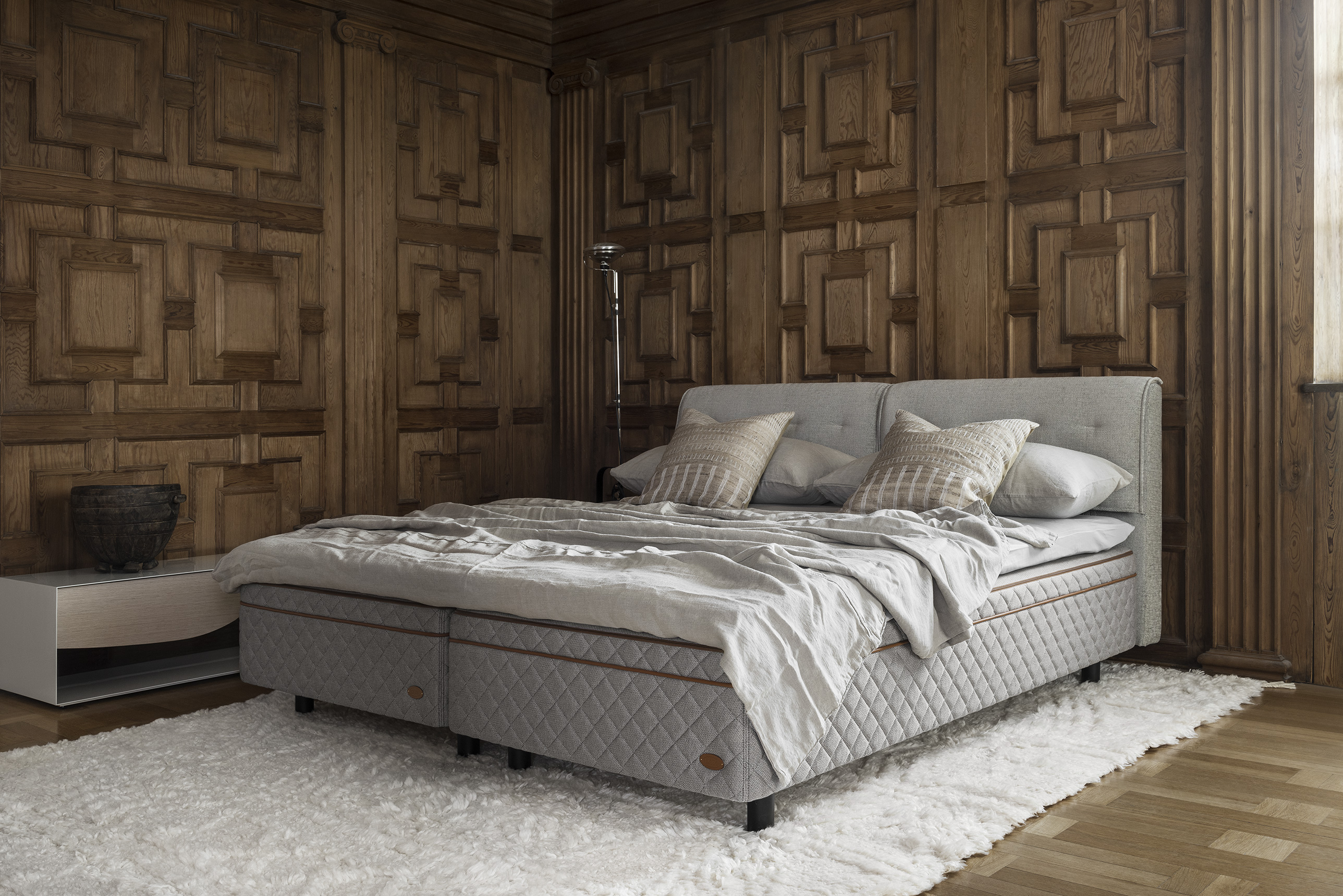  Bedroom with wooden walls and the DUX bed model 3003 with Faruk headboard